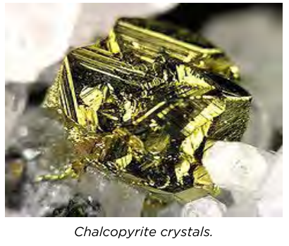 Chalcopyrite crystals, a copper-bearing mineral found in rock.